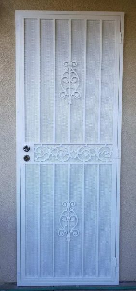 White security screen door with decorative iron scrollwork, providing an elegant yet secure front entry for residential homes.