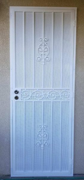White security screen door with decorative iron scrollwork, providing an elegant yet secure front entry for residential homes.