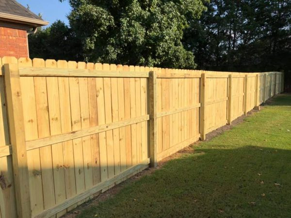 A beautiful and durable dog ear wood fence for your home - Enhance your residential property with our expertly crafted wood fence. Privacy, and durability in every panel.